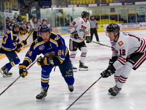 Fort McMurray defenceman Lucas Jones  chases after the puck in their game against the Whitecourt Wolverines on Wednesday, January 5, 2022. Photo by Dan Lines