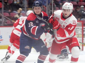 Saginaw Spirit forward Dean Loukas battles with Soo Greyhounds forward Bryce McConnell-Barker in OHL action on Dec. 29. Due to the recent Ontario government COVID-19 lockdowns the Greyhounds will play their home games without fans through Jan. 26.