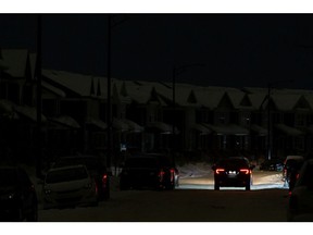 Dark houses are seen in the Glenridding Heights neighbourhood during a power outage affecting 42,000 Edmontonians in multiple neighbourhoods in Edmonton, on Monday, Jan. 10, 2022.
