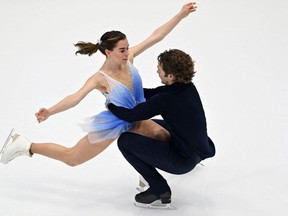 Canada's Evelyn Walsh and Trennt Michaud perform during the pairs free skating event of the ISU Four Continents Figure Skating Championships in Tallinn on January 22, 2022. (Photo by Daniel MIHAILESCU / AFP)