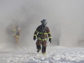Fort McMurray firefighters battle a house fire in Gregoire on Monday, Feb. 8, 2021. Sarah Williscraft/Fort McMurray Today/Postmedia Network
