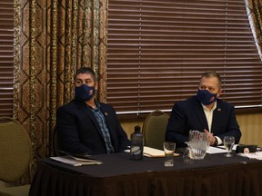 National Police Federation (NPF) Regional Directors Jeff McGowan (left) and Kevin Halwa (right) address community members at Stony Plain Inn & Suites on Friday, Jan. 7, 2022. The NPF is currently on a multi-municipality ‘Community Engagement Tour’ to garner support for keeping Alberta’s RCMP in favour of the province's proposed Alberta Provincial Police Service (APPS). Photo by Rudy Howell/Postmedia.