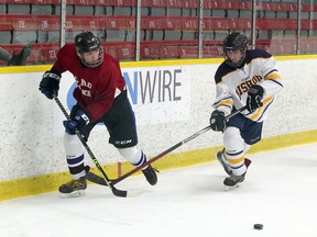 St. Charles College Cardinals and Bishop Alexander Carter Catholic Secondary School Golden Gators face off in SDSSAA exhibition hockey action at Garson Arena in Garson, Ontario on Saturday, October 23, 2021.