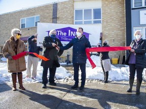 The Inn held a ribbon-cutting ceremony for its new homeless shelter at 10 Princess Avenue in St. Thomas on Tuesday. From left are Margaret Barrie, president of The Inn, board member Scott Doupe, Mayor Joe Preston, MPP Jeff Yurek, board member Kay Vaughan and executive director Lori Fitzgerald. (Derek Ruttan/The London Free Press)