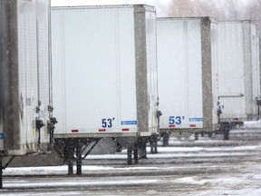 Parked tractor trailers, like these in London, are at risk of cargo theft, says the head of a company that specializes in cargo theft prevention and recovery after police reported the theft of four trucks and seven containers in Woodstock and St. Thomas last month. (Mike Hensen/The London Free Press)