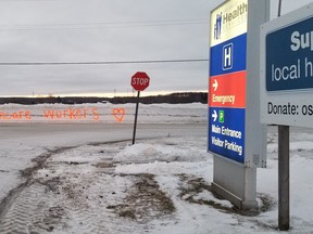 Someone spray-painted this thank-you sign on the side of a snowbank at the 8th Street East entrance of Owen Sound hospital, seen Friday, Jan. 21, 2022 in Owen Sound, Ont. (Scott Dunn/The Sun Times/Postmedia Network)