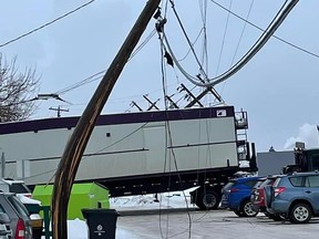 An oversized load caught a power line on Sherridon Drive near 99 Ave on Monday, Jan. 17. Photo via Facebook.