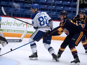 Sudbury Wolves forward David Goyette (88) looks for the loose puck in front of Barrie Colts goalie Matteo Lalama (30) as Colts defenceman Brandt Clarke (55) comes in on the play during OHL action at Sudbury Community Arena on Sunday, Nov. 28, 2021.