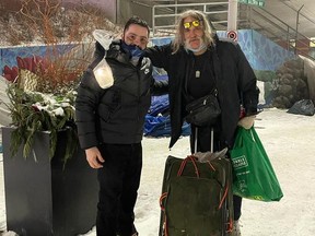 Deepak Thapar (left) stands with a newly-made friend at the Calgary Drop-In Centre during a Help Aid Canada food drive on Christmas Eve. Help Aid Canada have made their Alberta base in Airdrie, and aim to continue their working helping those in need.