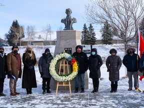 Members of the Filipino Airdrie Association (FAA) and the Philippine Consulate General Calgary gather infront of the Jose Rizal monument in Nose Creek Park with Mayor Peter Brown and councillor Tina Petrow for Rizal Day on December 30.