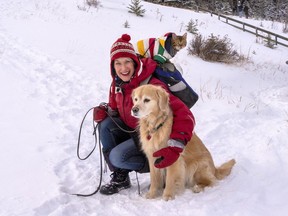 Marriage commissioner Twyla Jacobson goes for a walk with her cat Chingona, who has her own Instagram page @cattalesbychingona and dog Siobhan in Canmore on Saturday. photo by Pam Doyle/www.pamdoylephoto.com