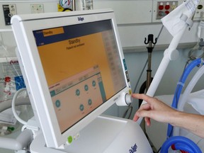 A Quinte Health Care worker demonstrates the use of a ventilator in the intensive care unit of Belleville General Hospital.