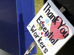 A sign thanking essential workers rests outside Belleville General Hospital during an earlier wave of the pandemic. People who want to support hospital workers may now do so on a Quinte Health Care webpage, by mail, or by making donations through hospitals' charitable foundations.