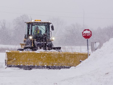 A snow plow clears the parking lot at Lynden Park Mall on Monday January 17, 2022 in Brantford, Ontario. The area received about 25 cm of snowfall overnight in the first significant snow storm of 2022. Brian Thompson/Brantford Expositor/Postmedia Network