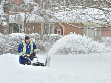 A heavy winter storm Sunday put most all snow blowers in Norfolk County to the test Monday morning. Among those clearing the sidewalk in front of their home in Port Dover was Alex Wilkinson, of Main Street. – Monte Sonnenberg
