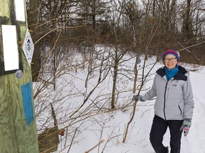 Deborah Vickers of Brantford stands on the Grand Valley Trail at the west end of Powerline Road in Brantford on Tuesday.