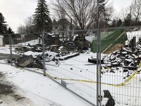 The shells of fire vehicles and debris are fenced off following the fire that completely engulfed and destroyed the Portland fire station in late December. (SUBMITTED PHOTO)