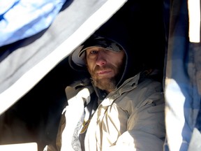 Joey Sullivan tries to keep warm during Friday's cold snap in one of Brockville's makeshift homeless camps. (RONALD ZAJAC/The Recorder and Times)