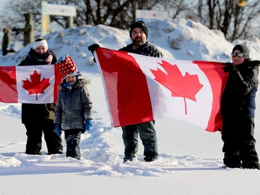 Vera Conway, Tom Davis and their sons Bryse, 5, left, and Owen, 11, right, join the protest from the side of Highway 401 on Friday morning. (RONALD ZAJAC/The Recorder and Times)