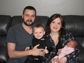 Megan Mazan had her second child, Freya, at home on Dec. 31, 2021, with the help of a local midwife, after giving birth to her first child in hospital two years ago. They are seen here the rest of the family – dad Jeff Mazan and son Typhon. Ellwood Shreve/Postmedia