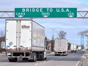 Transport trucks approach the Canada/USA border crossing in Windsor in this file photo from March 2020. Chatham-Kent-Leamington MPP Rick Nicholls is calling on senior levels of government to back down from an upcoming vaccine mandate for cross-border truckers.
THE CANADIAN PRESS/Rob Gurdebeke