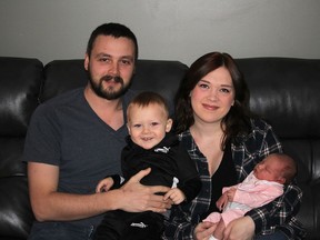 Megan Mazan had her second child, Freya, at home on Dec. 31, 2021, with the help of a local midwife, after giving birth to her first child in hospital two years ago. They are seen here the rest of the family – dad Jeff Mazan and son Typhon. (Ellwood Shreve/Chatham Daily News)