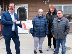 Mayor Darrin Canniff, left, presents a certificate to Doreen and Tom Murphy, of Wallaceburg, for their good deeds through the Chatham-Kent Good Neighbour Recognition Program. The Murphys were nominated by Cheryl Knight, back, who also suggested the program to the municipality. (Ellwood Shreve/Chatham Daily News)