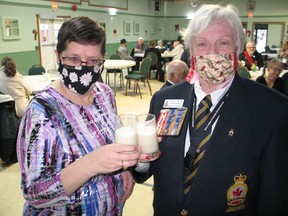 Royal Canadian Legion Branch 297 acting president Dona McNish (right) and legion member Jennifer Vipond with a Moose Milk toast to 2022. Photo on Saturday, January 1, 2022, in Cornwall, Ont. Todd Hambleton/Cornwall Standard-Freeholder/Postmedia Network