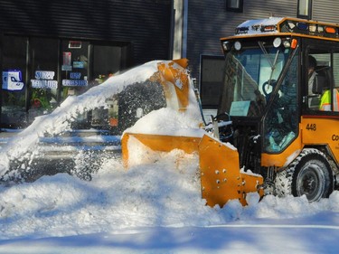 Efforts to clean sidewalks, following the heavy dump of snow experienced in the city over the weekend, were underway in Cornwall's downtown on Monday January 3, 2022 in Cornwall, Ont. Francis Racine/Cornwall Standard-Freeholder/Postmedia Network
