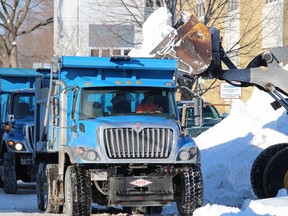 A snow relocation operation in progress along Augustus Street in Cornwall on Tuesday afternoon. Photo on Tuesday, January 18, 2022, in Cornwall, Ont. Todd Hambleton/Standard-Freeholder/Postmedia Network