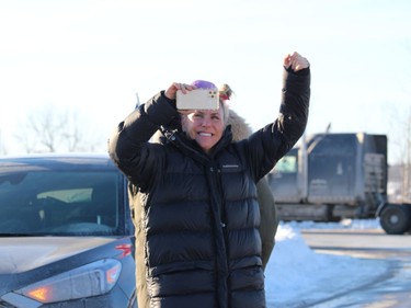 A convoy supporter outside her car on an on-ramp in the Vankleek Hill area. Photo on Friday, January 28, 2021, in Vankleek Hill, Ontario.Todd Hambleton/Standard-Freeholder/Postmedia Network