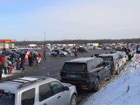 Hundreds of people, including truck drivers and supporters of the Freedom Convoy, gathered at the Petro-Pass Truck Stop on Boundary Rd. in a frenzy of excitement and vigor. The convoy departed towards Ottawa shortly before 10 a.m. Saturday January 29, 2022 in Cornwall, Ont. Shawna O'Neill/Cornwall Standard-Freeholder/Postmedia Network