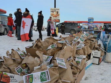 Community members set up stations with food and essentials for truck drivers, including Katrina's Corner Kitchen, who provided pre-made meals on Saturday January 29, 2022 in Cornwall, Ont. Shawna O'Neill/Cornwall Standard-Freeholder/Postmedia Network