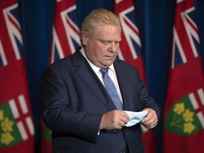 Ontario Premier Doug Ford attends a news conference in Toronto on Monday January 3, 2022, when he announced Ontario would move schools online as part of its bid to slow the spread of COVID-19.