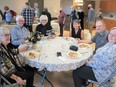 Tina, Jack, Karen, Joyce, Dennis and Maureen enjoy the monthly hot lunch at Seniors on the Bow on November 19. Patrick Gibson/Cochrane Times