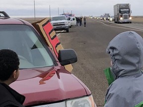 Cynthia Schatz  and her two sons travelled to Brooks on Jan. 24 to watch the Canada Freedom Convoy pass along the Trans Canada Highway. Cynthia Schatz photo