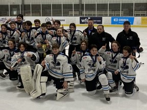 The Kent Cobras celebrate after winning the U14 AA championship at the 61st Riverside International Christmas Hockey Tournament in Windsor, Ont., on Dec. 29, 2021. The Cobras are: Brady Walker, Carson Roth, Kaleb Cranston, Brody Steinman, Logan Bell, Trent Bruhlman, Matt Daoust, Ethan Bester, Logan Cornish, Brady Gibson, Dylan Hoekstra, Brody Holmes, Luke Holmes, Dante McKaig-Haro, Cohen Ovecka, Rhys St. Germain, Connor Stinson, Hudson Wathy, head coach Lucky Holmes, assistant coaches Jared Cornish, Jeff Drexler and Mike Stinson, and manager Michele Turato. (Contributed Photo by Jeff Gibson)