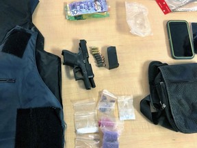A 9-mm Glock, ammunition, fentanyl, crystal methamphetamine, cash, body armour and cellphones seized by Kingston Police on Saturday afternoon in Kingston. Kingston Police
