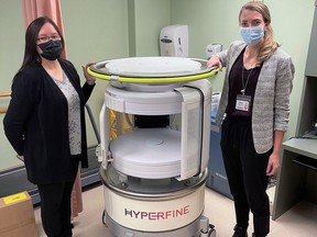 Dr. Elaine Innes, Weeneebayko General Hospital chief of staff, and Queen's University medical student Chloe Des Roche with a portable MRI shortly after it arrived in Moose Factory. Kingston Health Sciences Centre