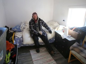 John Tuinstra, 45, sits inside his tiny cabin at Portsmouth Olympic Harbour in Kingston on Thursday.