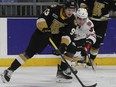 Kingston Frontenacs forward Maddox Callens gets in front of Niagara IceDogs Anthony Agostinelli during Ontario Hockey League action in Kingston on Saturday night.