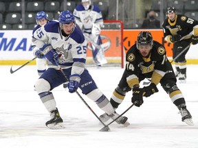 Kingston Frontenacs Zayde Wisdom checks Sudbury Wolves Dominik Jendek during Ontario Hockey League action at the Leon's Centre in Kingston on Friday January 14, 2022. Ian MacAlpine/KingstonWhig-Standard/Postmedia Network