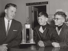 The Museum of Northern History needs your help identifying the youths in this photo taken at the Princess Hotel. The year is unknown.
The man on the left is Art Hillman. He is believed to be awarding the Ted Lindsay Annual Award for Most Valuable Player