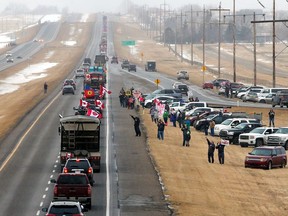 Supporters of the "Freedom Convoy" of truckers gather on the edge of the Trans-Canada Highway east of Calgary, Monday. The truckers and their supporters will pass through North Bay Friday on their way to Ottawa to protest the federal government's COVID-19 vaccine mandate for cross-border truckers.

Gavin Young/Postmedia