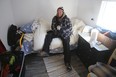 John Tuinstra, 45, sits inside his tiny cabin at Portsmouth Olympic Harbour in Kingston on Thursday. Ian MacAlpine/Postmedia Network