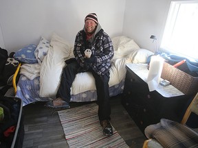 John Tuinstra, 45, sits inside his tiny cabin at Portsmouth Olympic Harbour in Kingston on Thursday. Ian MacAlpine/Postmedia Network