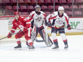 Soo Greyhounds forward Justin Cloutier and Windsor Spitfires defenceman Louka Henault watch for the puck in front of Spits goalie Xavier Medina during OHL action on Sunday afternoon at GFL Memorial Gardens. The Spits picked up a 10-4 win over the Hounds at the downtown rink. Gordon Anderson