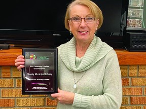 Bev Olson, manager of the Stavely Municipal Library, holds a plaque from the Community Foundation of Lethbridge and Southwestern Alberta, which provided a $6,500 grant for informaiton technology upgrades to increase internet speeds at the library.