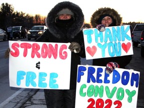 These two ladies stood on the side of Highway 17 near Pembroke for hours Friday, waiting to catch a glimpse of Freedom Convoy on its way to Ottawa.