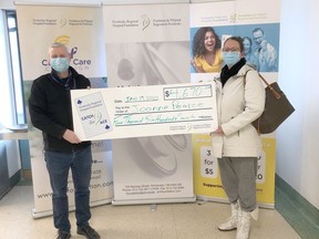 Executive director of the Pembroke Regional Hospital Foundation, Roger Martin presents the Catch the Ace 3.0 week 26 prize winner, Joanne Pearce with her winnings. Submitted photo